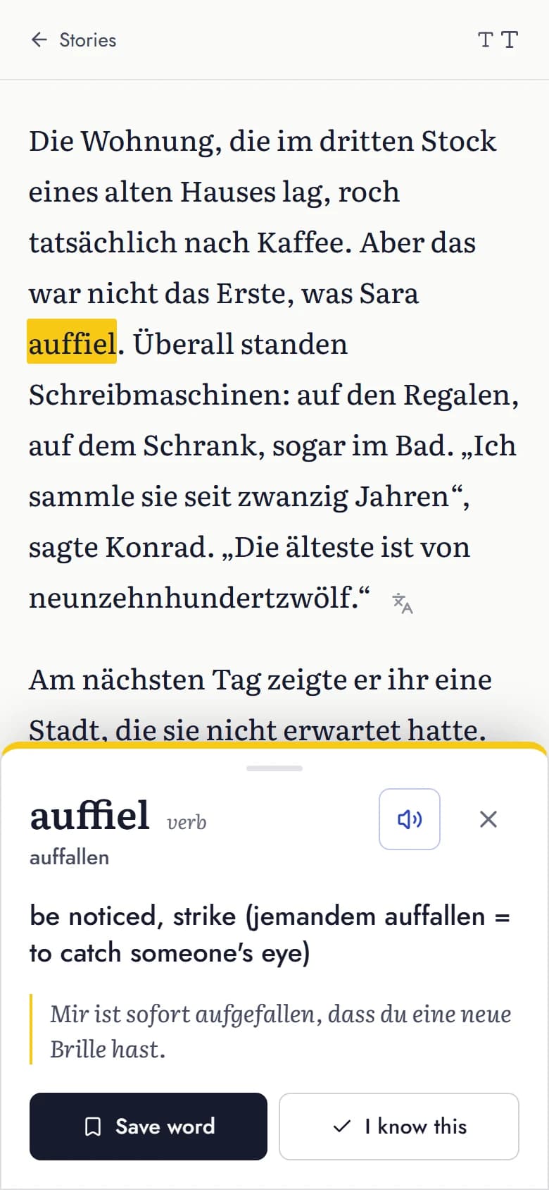 Morgenlese reader on a phone: the word auffiel is highlighted and a sheet shows its dictionary form auffallen, the English meaning and an example sentence